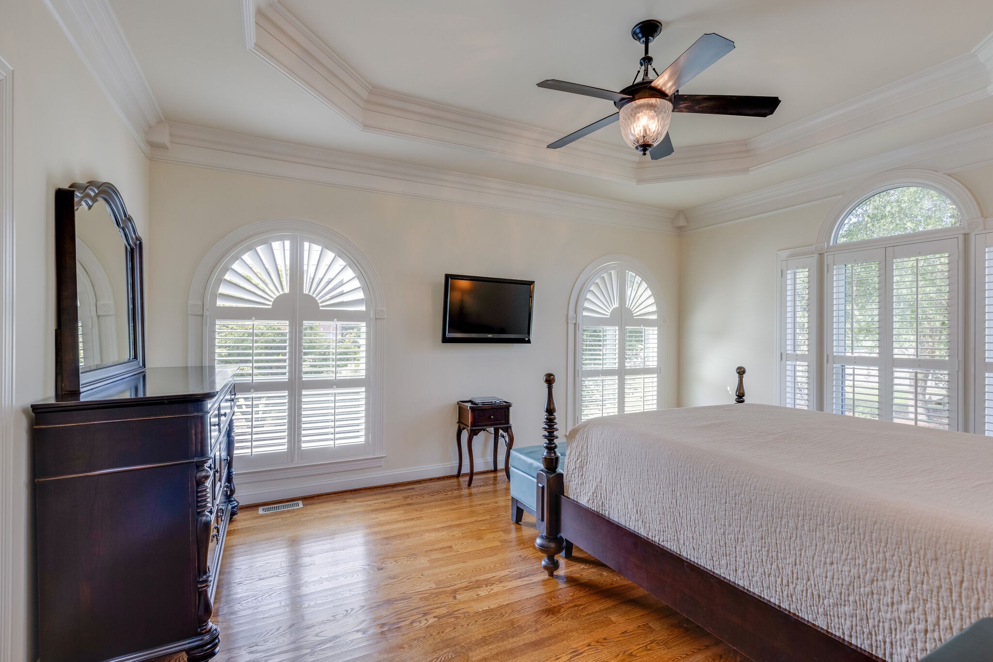 200 Eiderdown Drive Franklin, TN 37064 - Photo 14 of 45 a bedroom with a bed and a flat screen tv
