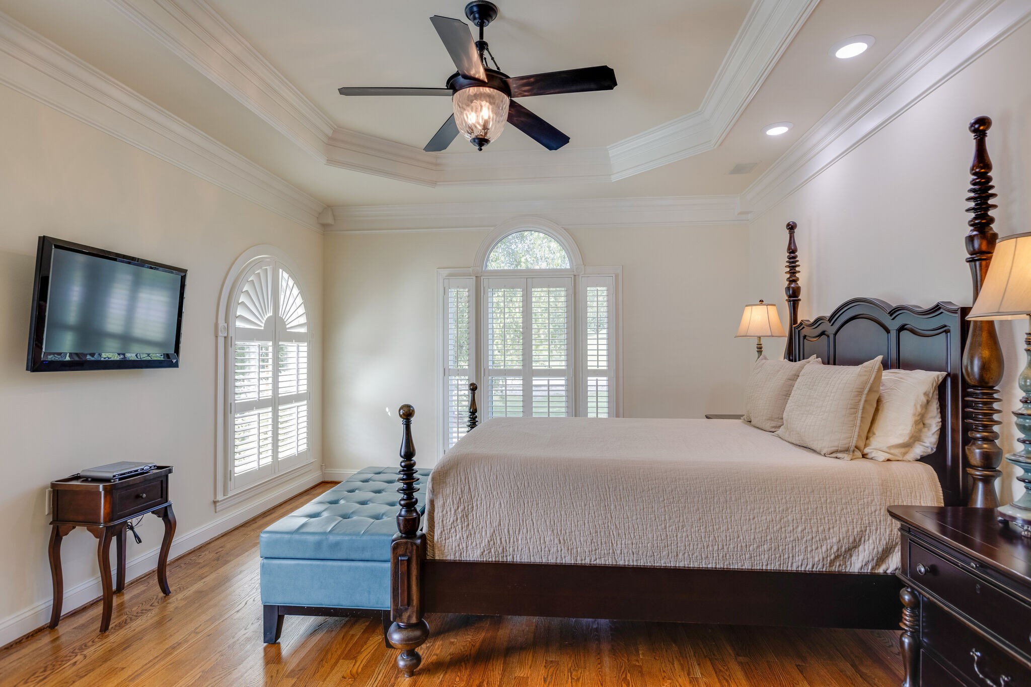 200 Eiderdown Drive Franklin, TN 37064 - Photo 15 of 45 a bedroom with a bed a chandelier and dresser
