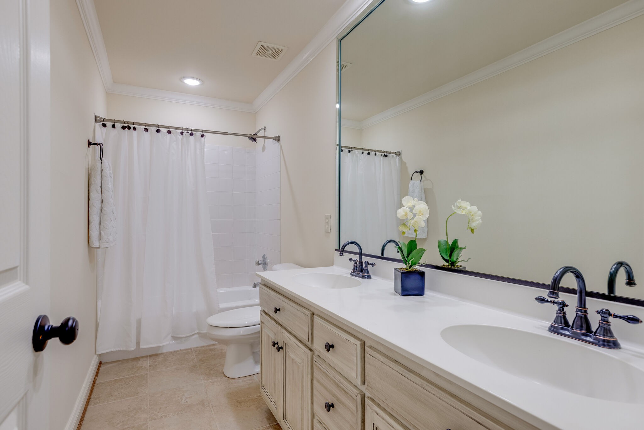 200 Eiderdown Drive Franklin, TN 37064 - Photo 25 of 45 a bathroom with double vanity sinks a toilet and a mirror