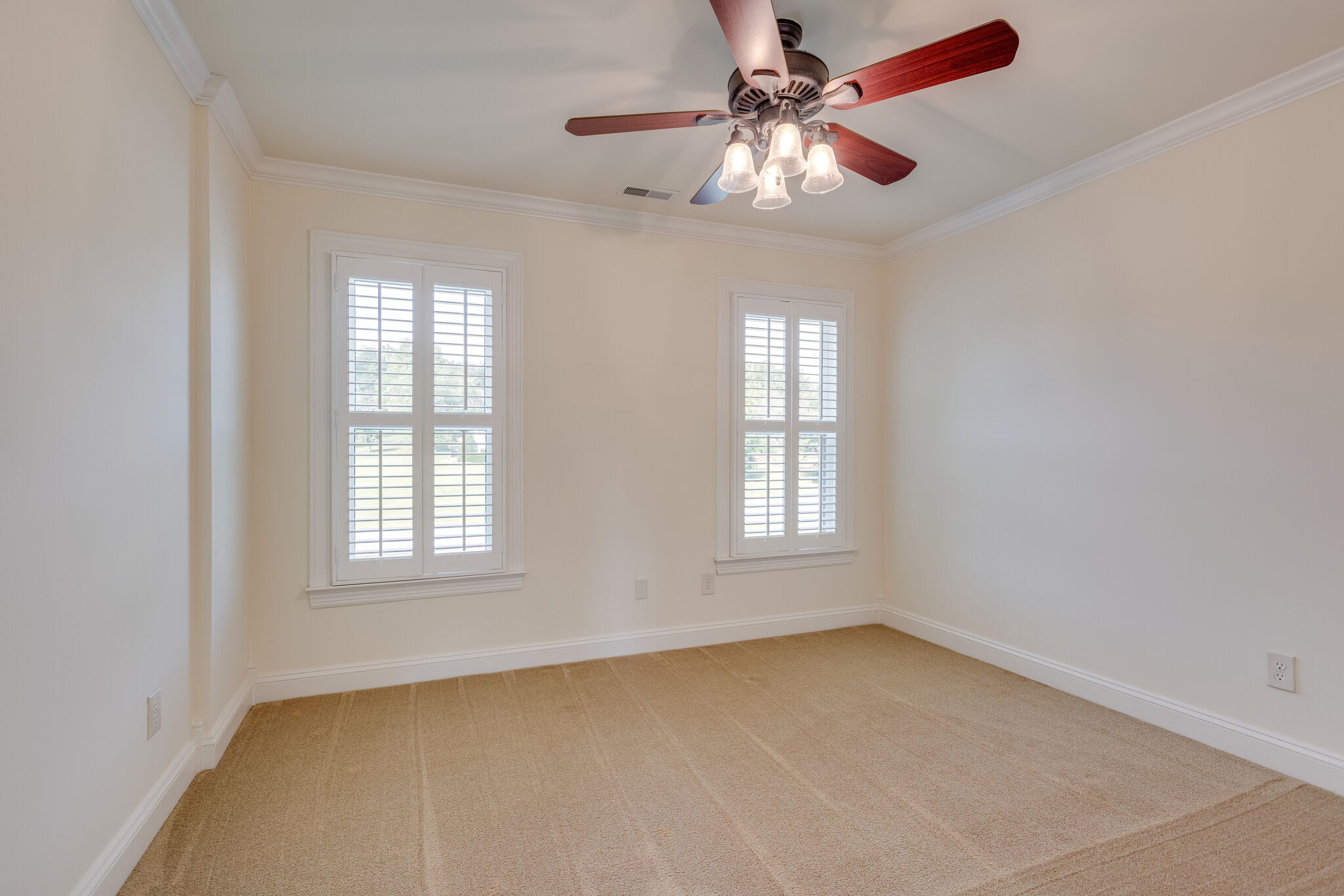 200 Eiderdown Drive Franklin, TN 37064 - Photo 27 of 45 an empty room with chandelier fan and windows