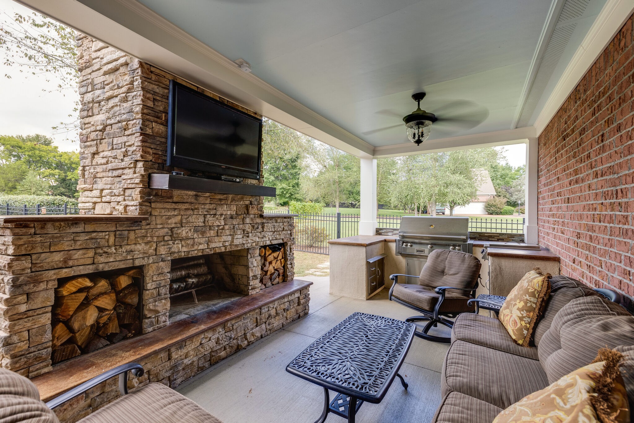 200 Eiderdown Drive Franklin, TN 37064 - Photo 31 of 45 a living room with furniture a flat screen tv and a fireplace