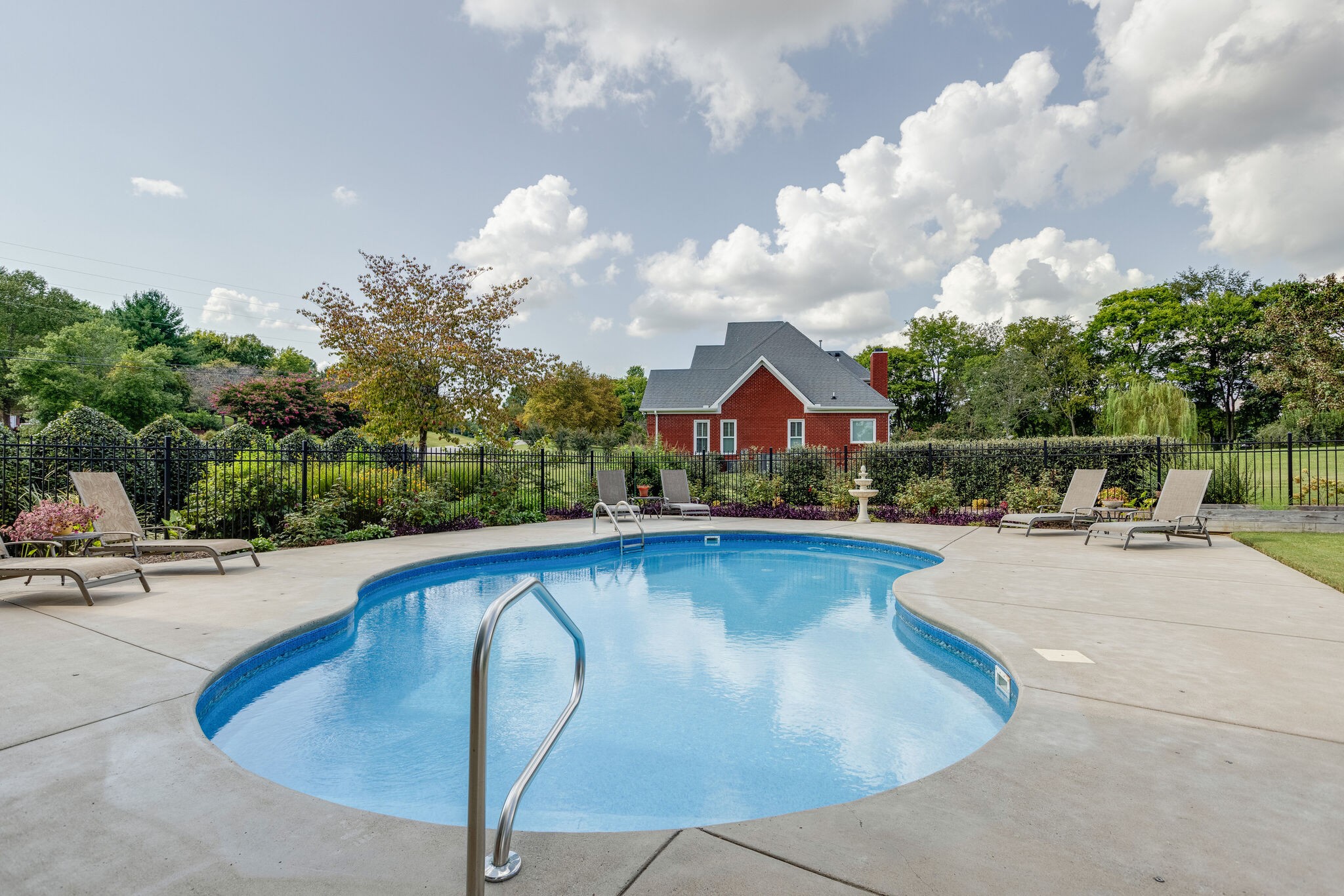 200 Eiderdown Drive Franklin, TN 37064 - Photo 32 of 45 a view of swimming pool with outdoor seating and yard in back
