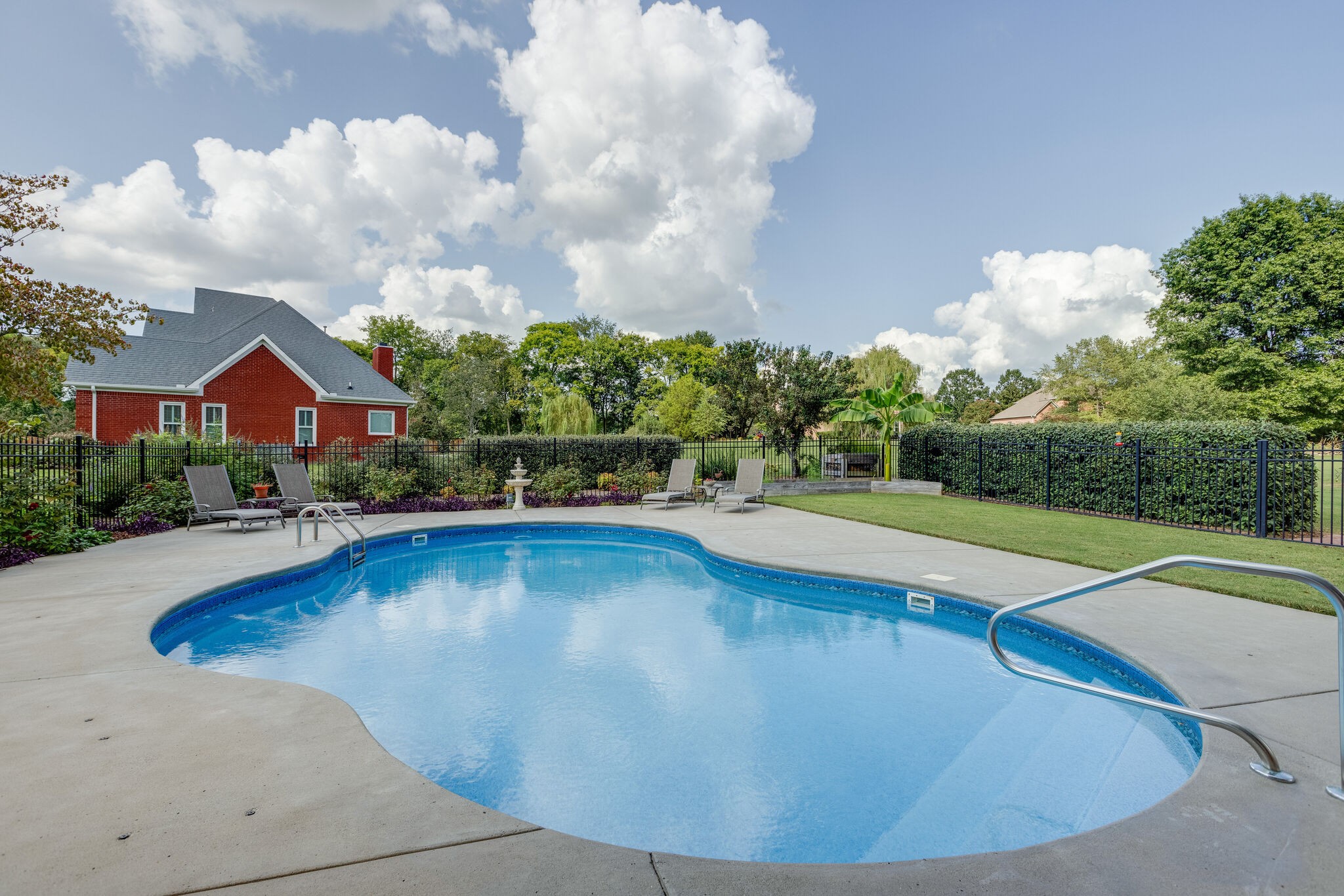 200 Eiderdown Drive Franklin, TN 37064 - Photo 33 of 45 a view of pool with lawn chairs and plants