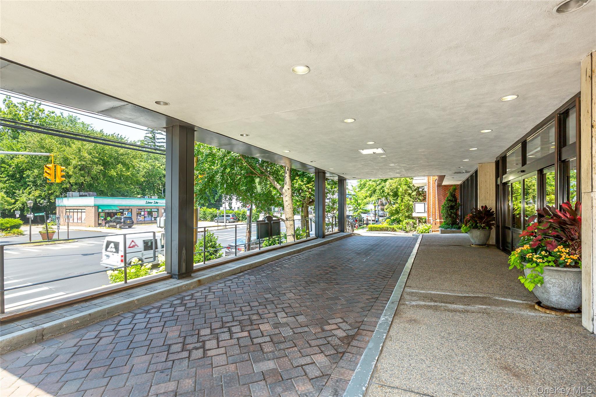 1 Kensington Gate, Unit 302 Great Neck, NY 11021 - Photo 27 of 30 a view of a building with garden