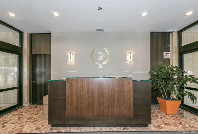a kitchen with a refrigerator and potted plant