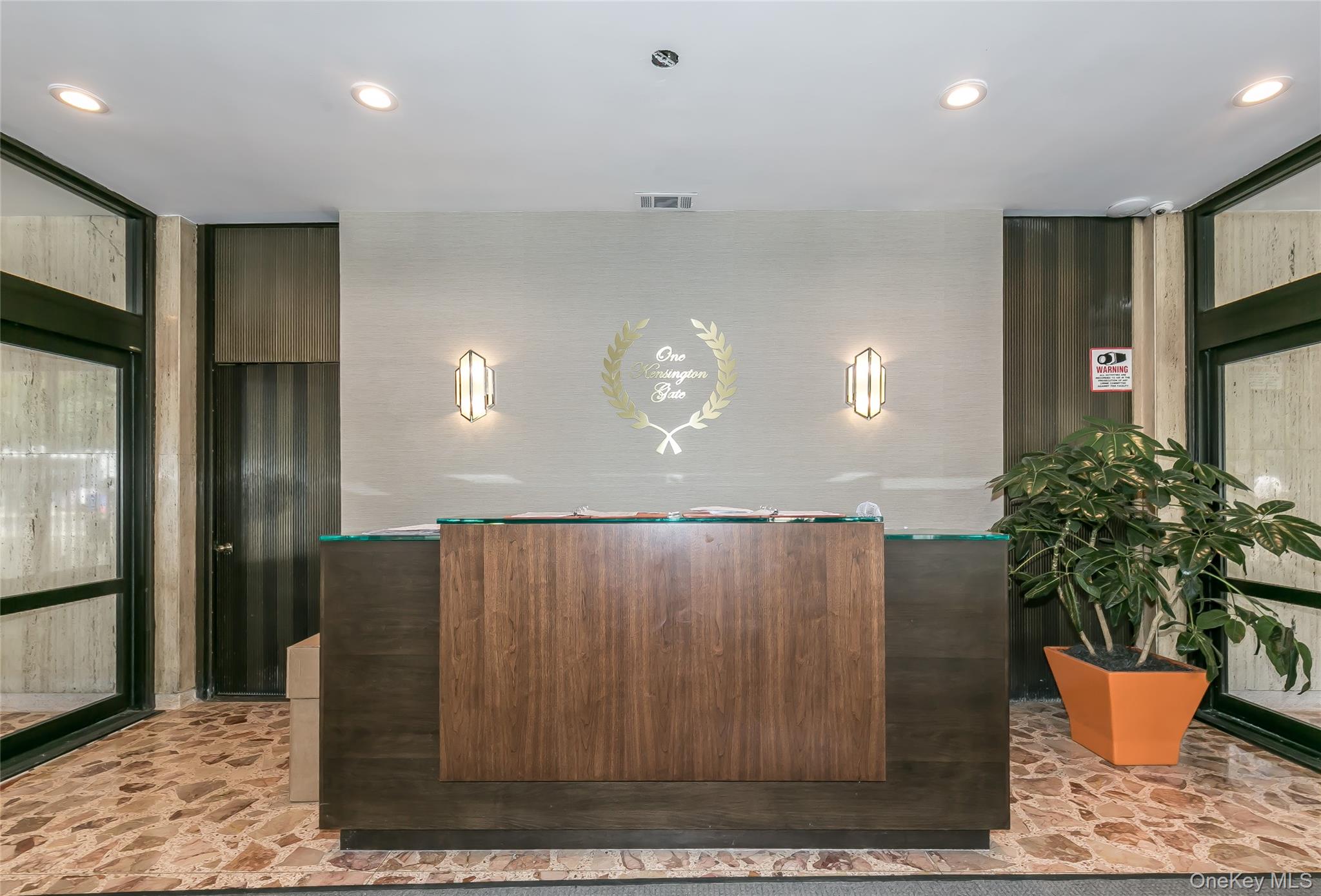 1 Kensington Gate, Unit 302 Great Neck, NY 11021 - Photo 3 of 30 a kitchen with a refrigerator and potted plant