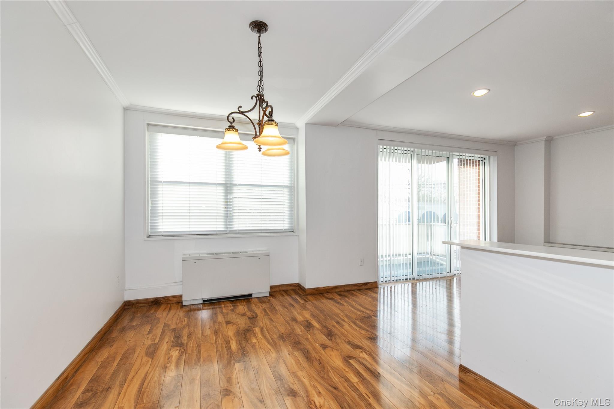 1 Kensington Gate, Unit 302 Great Neck, NY 11021 - Photo 10 of 30 a view of empty room with wooden floor and fan