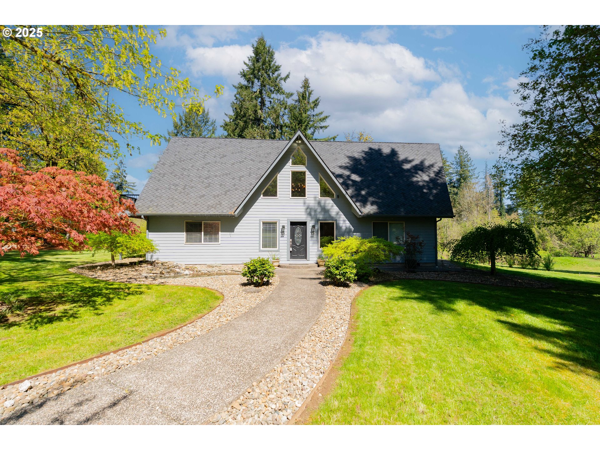 2126 Northeast 194th Street Ridgefield, WA 98642 - Photo 1 of 44 a front view of house with swimming pool and green space