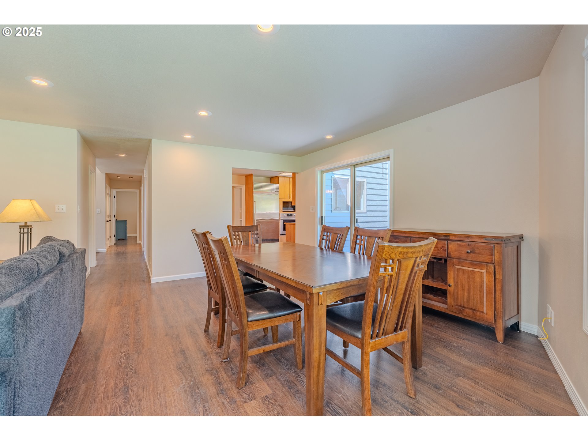 2126 Northeast 194th Street Ridgefield, WA 98642 - Photo 11 of 44 a view of a dining room with furniture and wooden floor
