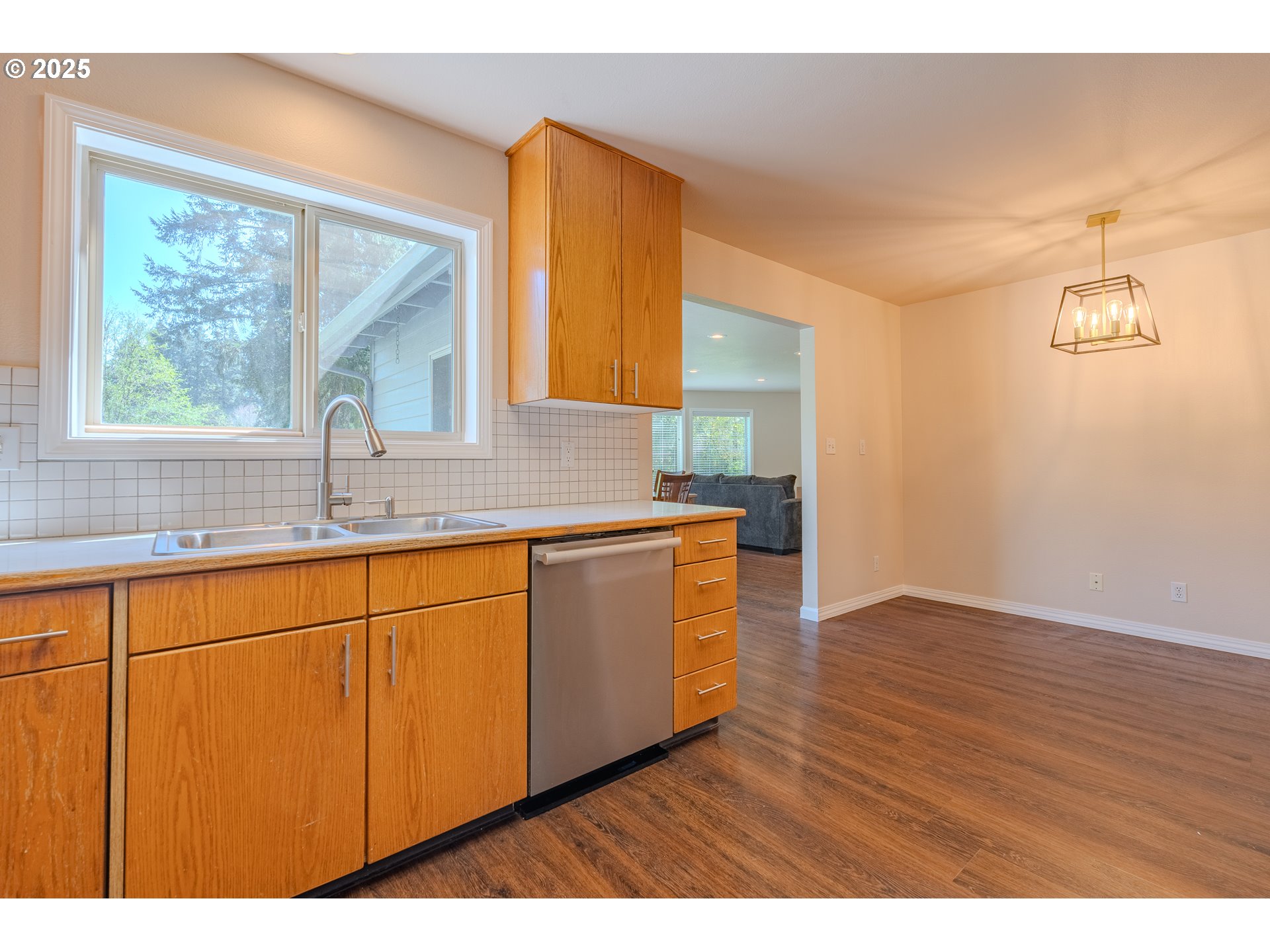 2126 Northeast 194th Street Ridgefield, WA 98642 - Photo 15 of 44 a kitchen with granite countertop wooden cabinets a sink and a window