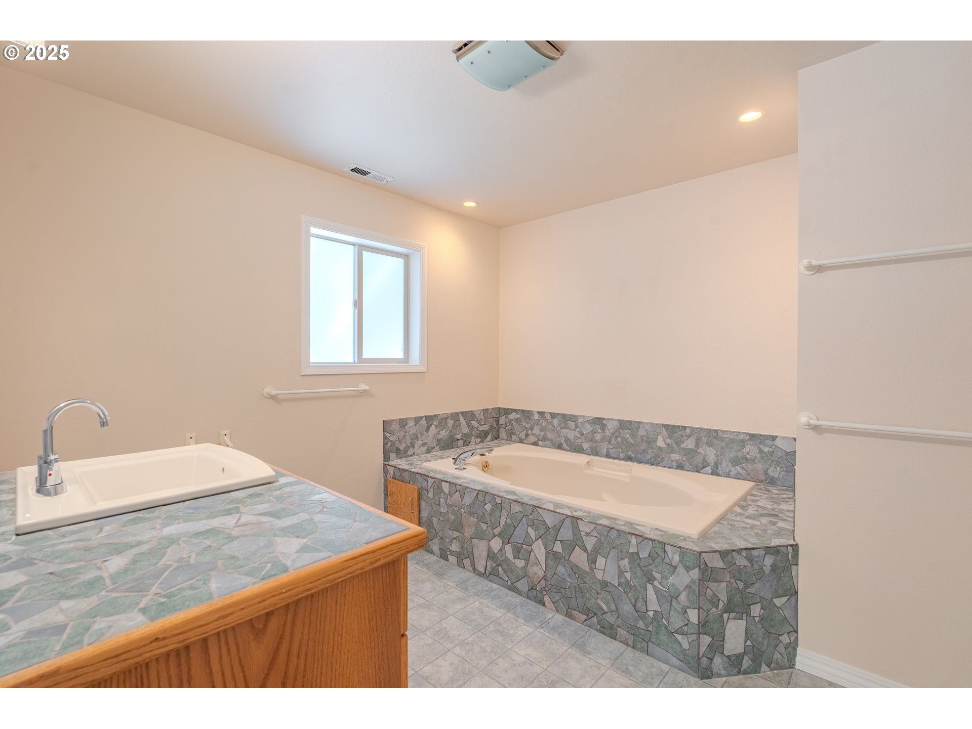 2126 Northeast 194th Street Ridgefield, WA 98642 - Photo 24 of 44 a bathroom with a sink and a bathtub