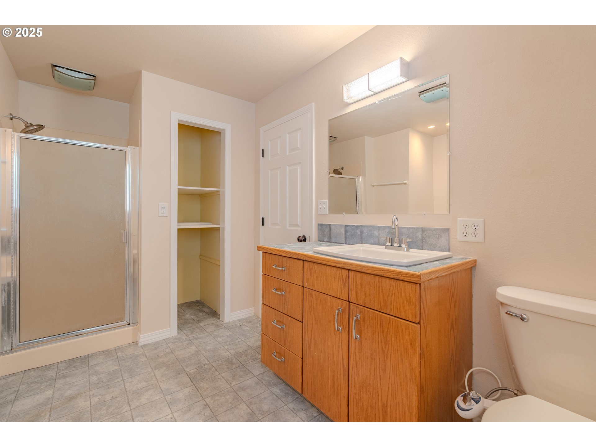 2126 Northeast 194th Street Ridgefield, WA 98642 - Photo 25 of 44 a bathroom with a sink a toilet and shower