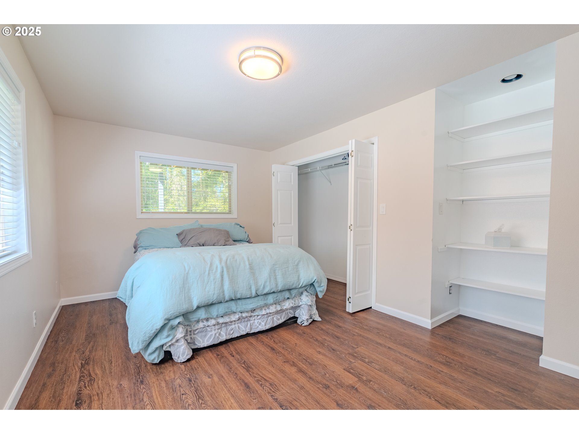 2126 Northeast 194th Street Ridgefield, WA 98642 - Photo 28 of 44 a bedroom with a bed and a window