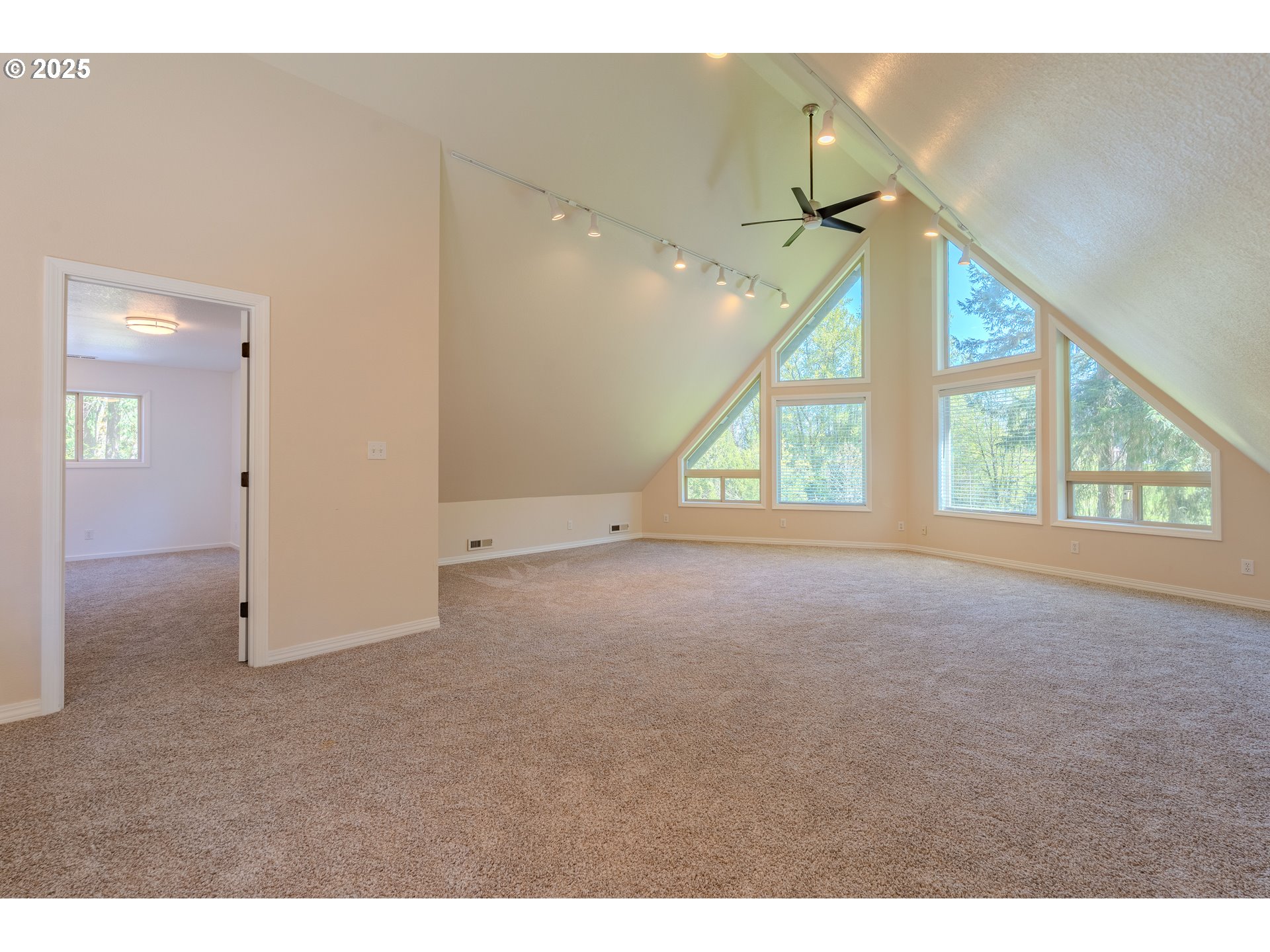 2126 Northeast 194th Street Ridgefield, WA 98642 - Photo 4 of 44 a view of an empty room with a window and chandelier