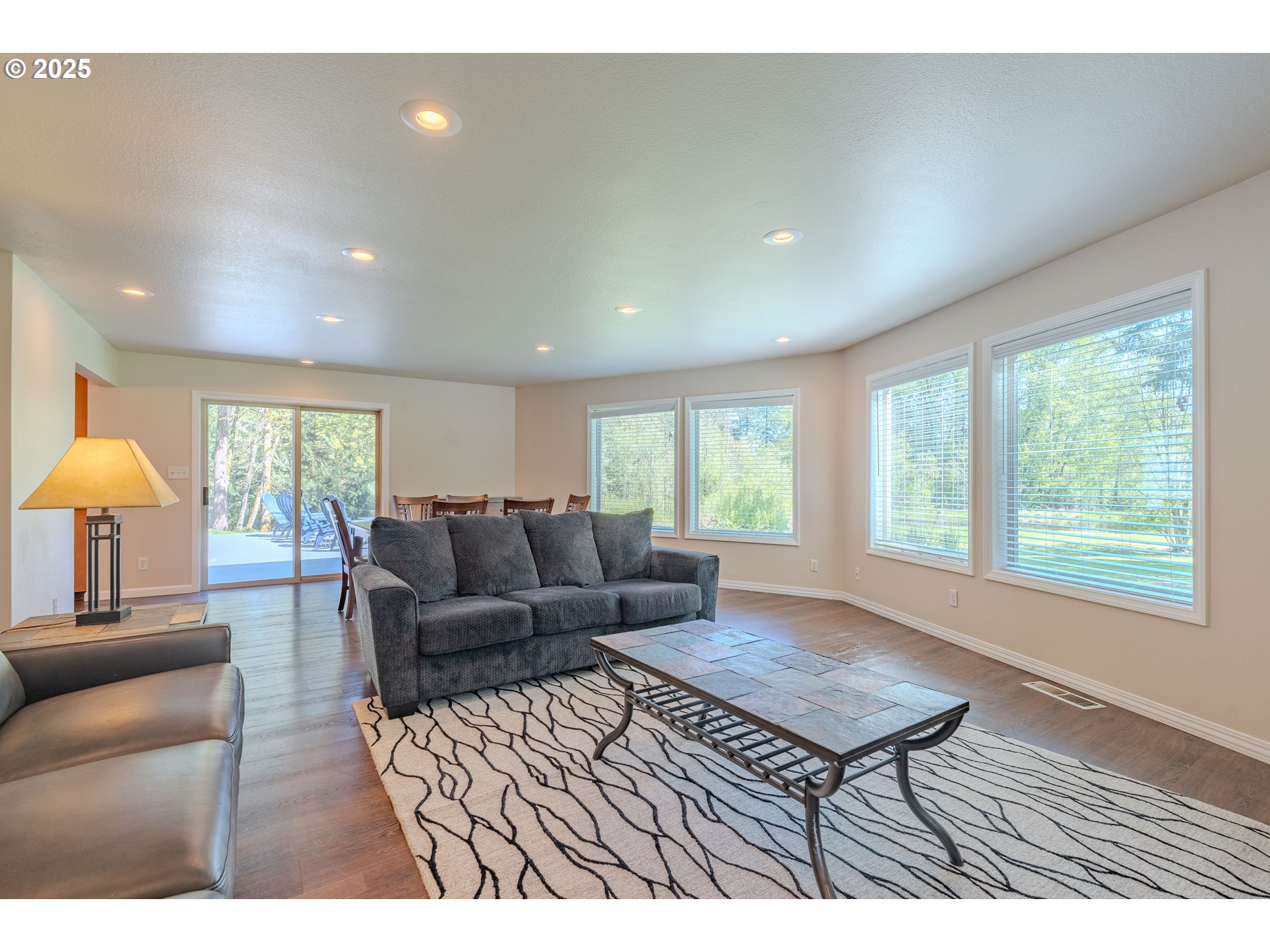 2126 Northeast 194th Street Ridgefield, WA 98642 - Photo 8 of 44 a living room with furniture a window and a table