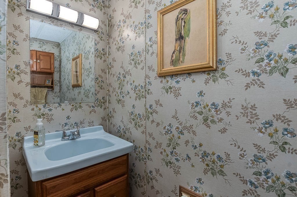5 Timber Lane Wareham, MA 02571 - Photo 14 of 31 a bathroom with a sink and a mirror
