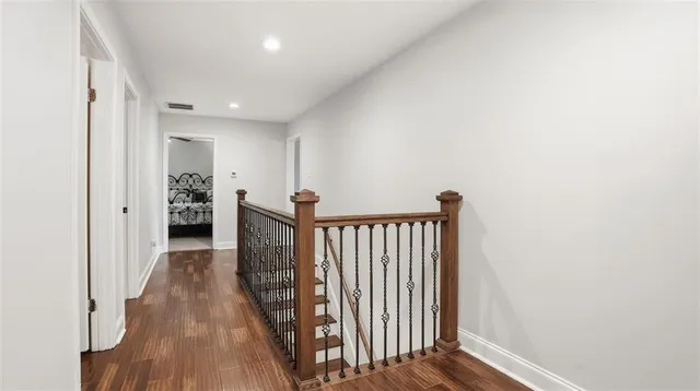 a bathroom with a double vanity sink window and mirror