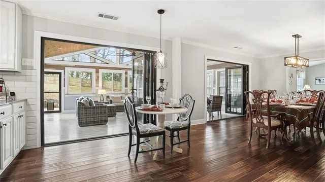 a view of a roof deck with wooden floor and umbrella