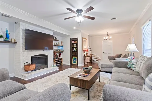 a kitchen with granite countertop white cabinets and stainless steel appliances