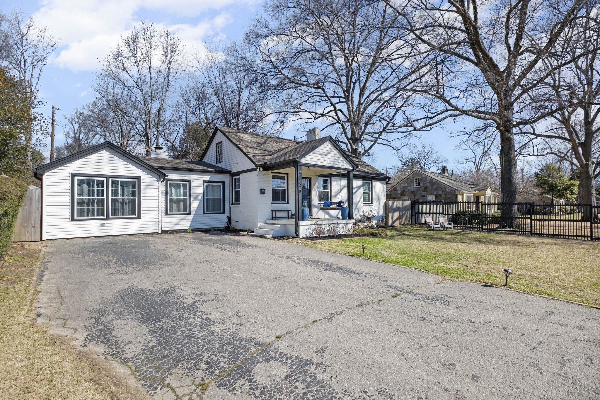 4120 Village Road Memphis, TN 38117 - Photo 28 of 28 View of front facade with asphalt driveway and a chimney