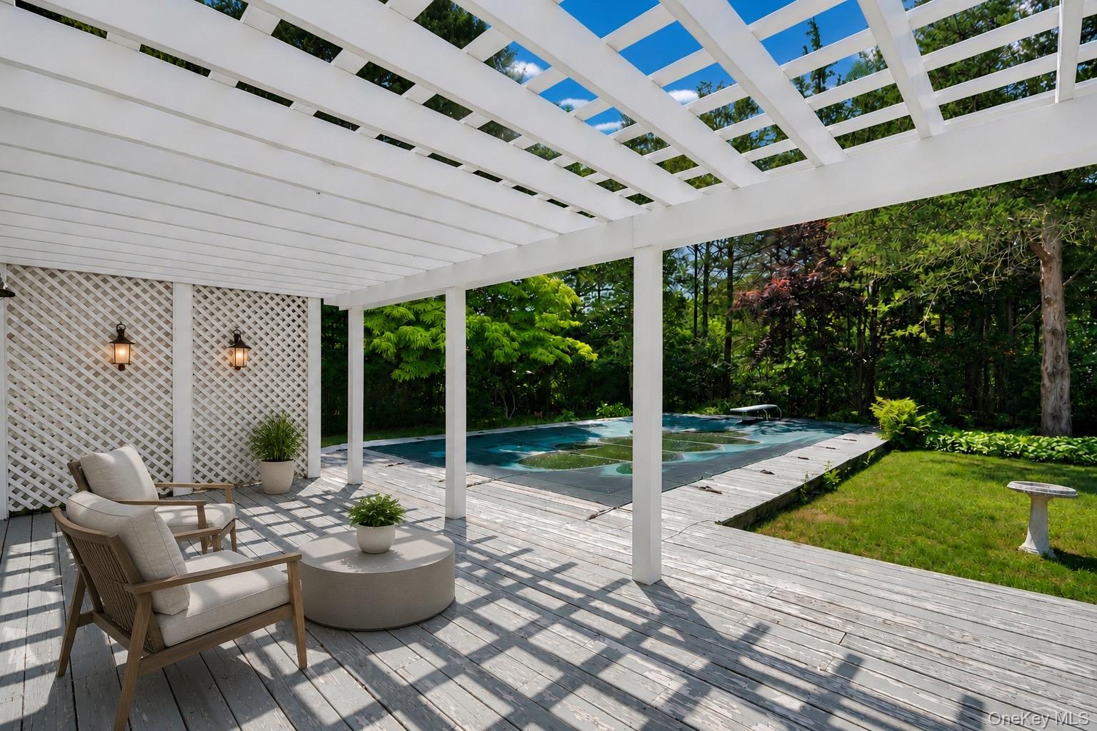 7 Tuthill Lane Remsenburg, NY 11960 - Photo 25 of 43 Patio overlooking the pool (Virtually Staged)