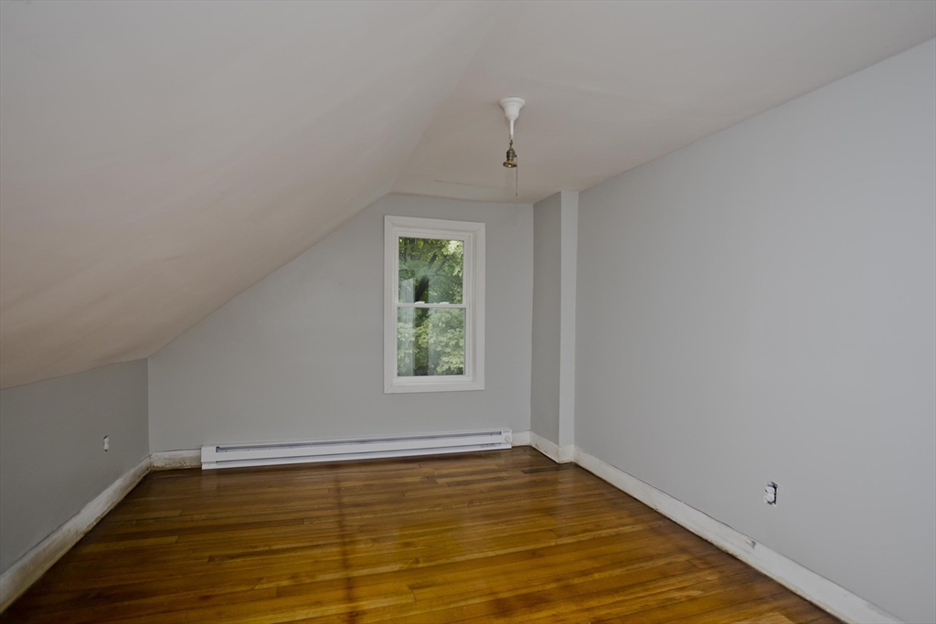 293-295 Water Street Springfield, MA 01151 - Photo 14 of 36 an empty room with wooden floor and windows