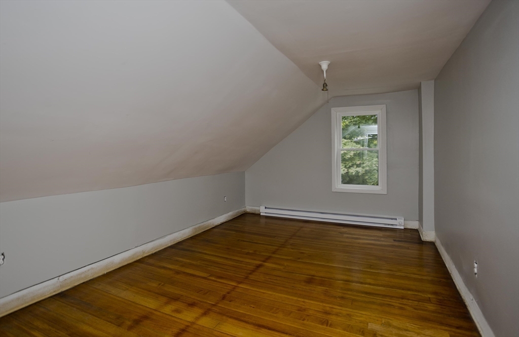 293-295 Water Street Springfield, MA 01151 - Photo 16 of 36 wooden floor in an empty room with a window