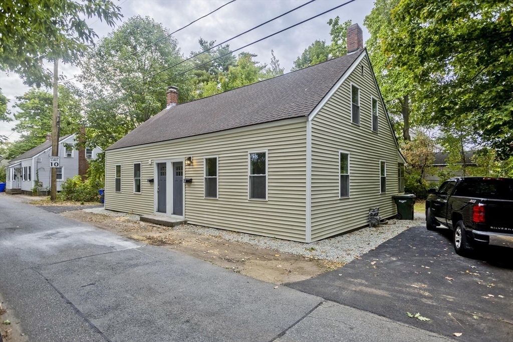 293-295 Water Street Springfield, MA 01151 - Photo 2 of 36 a view of a house with a small yard and a large tree