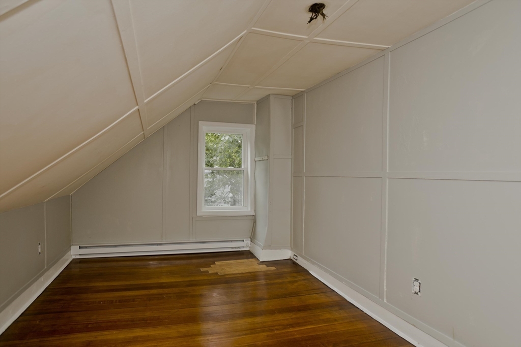 293-295 Water Street Springfield, MA 01151 - Photo 21 of 36 a view of a room with wooden floor and white walls