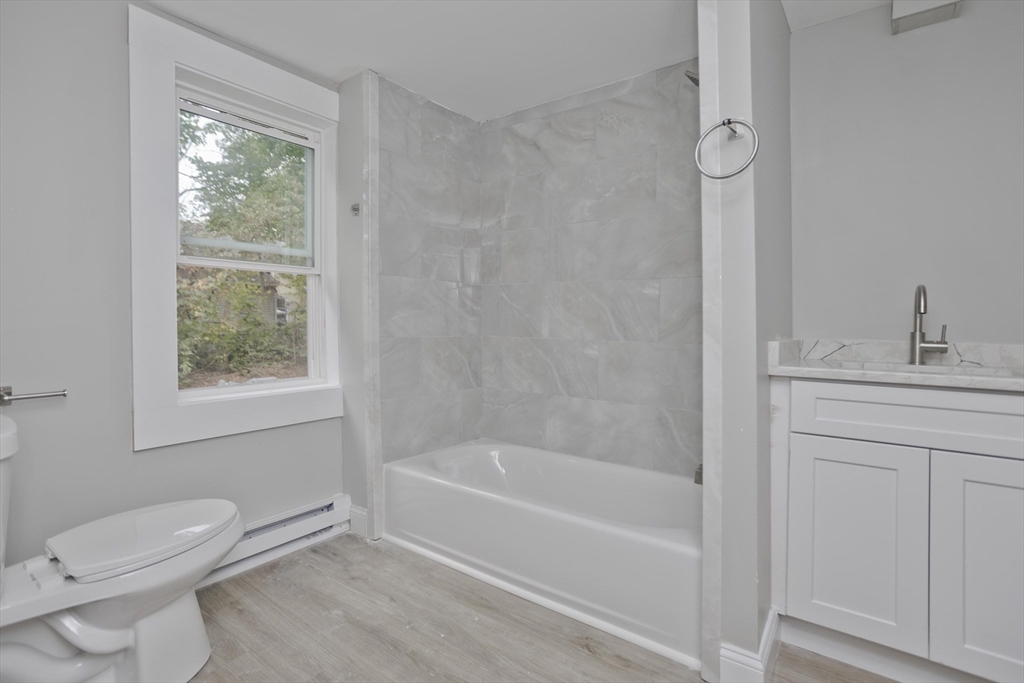 293-295 Water Street Springfield, MA 01151 - Photo 24 of 36 a bathroom with a sink toilet and bathtub