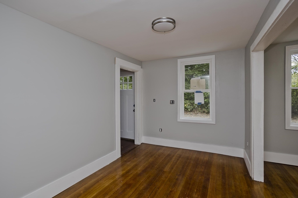 293-295 Water Street Springfield, MA 01151 - Photo 28 of 36 an empty room with wooden floor and windows