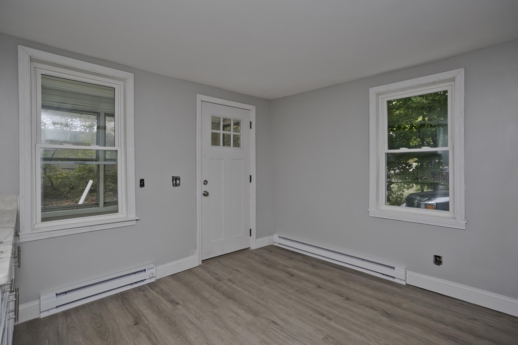 293-295 Water Street Springfield, MA 01151 - Photo 3 of 36 an empty room with wooden floor and windows