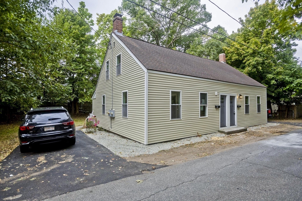 293-295 Water Street Springfield, MA 01151 - Photo 35 of 36 a view of a house with a car parked in front of a house