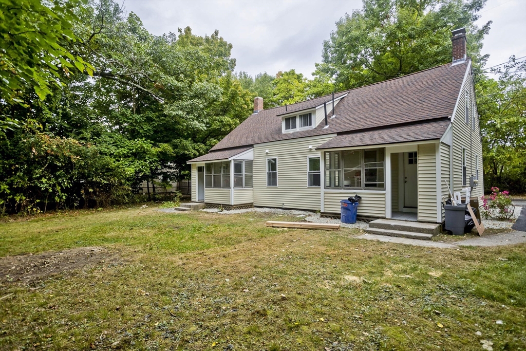 293-295 Water Street Springfield, MA 01151 - Photo 36 of 36 a view of a house with backyard sitting area and garden