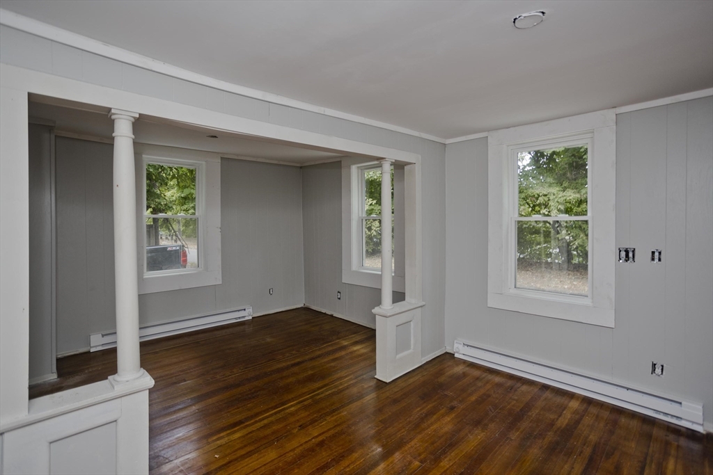 293-295 Water Street Springfield, MA 01151 - Photo 10 of 36 an empty room with wooden floor and windows