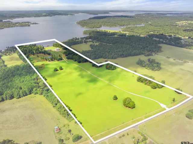 a view of a pool and an outdoor seating