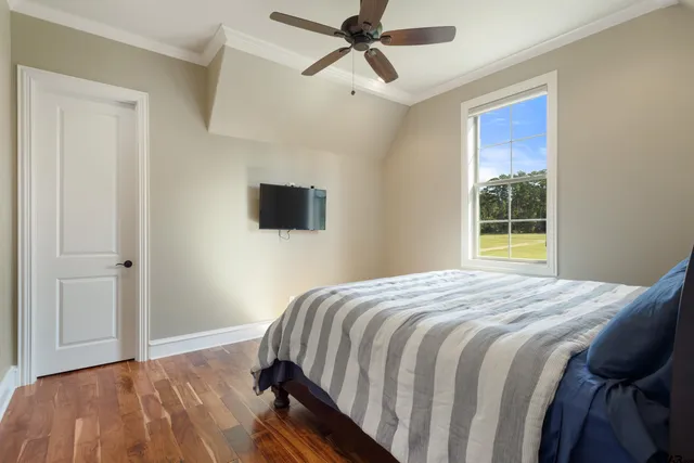 a bathroom with a granite countertop toilet a sink and a mirror