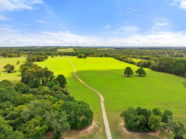 a view of a lake with a big yard
