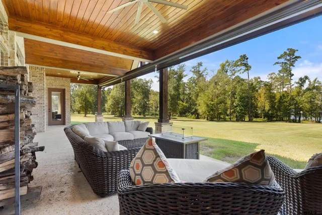 a view of a patio with a table and chairs