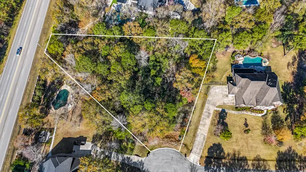 an aerial view of a residential apartment building with a yard