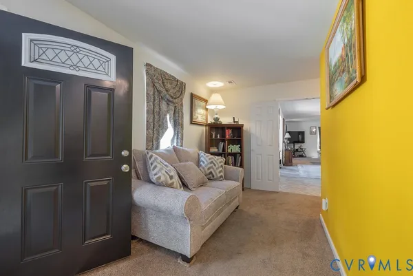 a bathroom with a sink a toilet and shower curtain