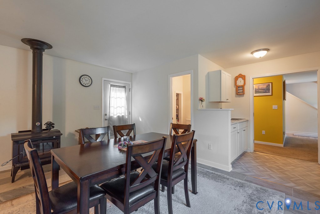 19001 Old Stage Road Dinwiddie, VA 23841 - Photo 17 of 84 a view of a dining room with furniture and wooden floor