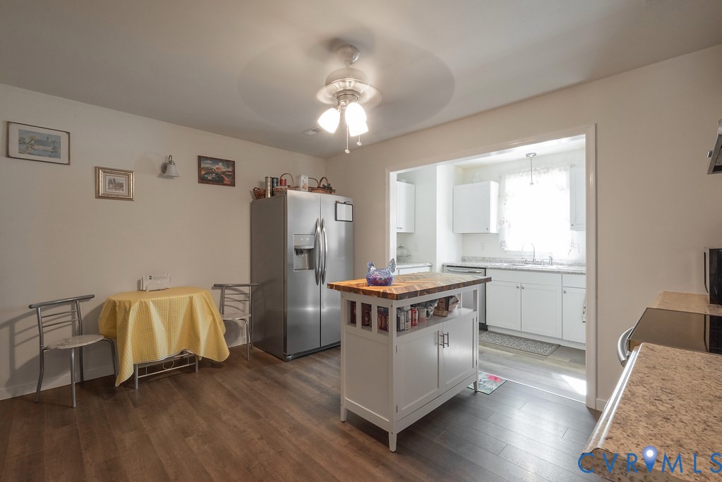 19001 Old Stage Road Dinwiddie, VA 23841 - Photo 23 of 84 a kitchen with stainless steel appliances granite countertop a stove and a refrigerator