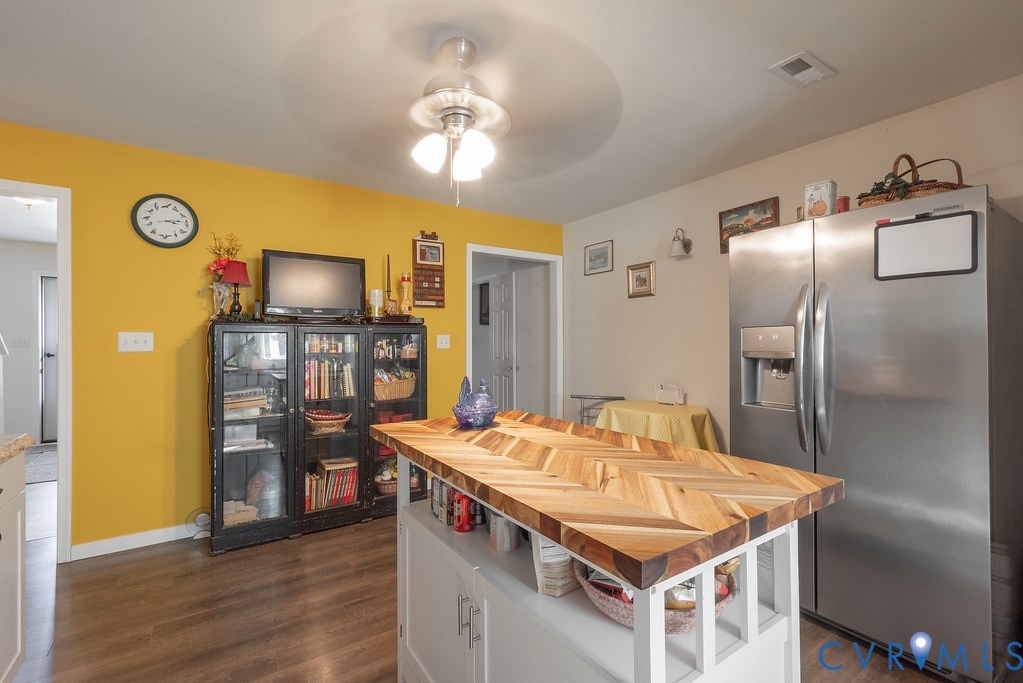 19001 Old Stage Road Dinwiddie, VA 23841 - Photo 25 of 84 a kitchen with stainless steel appliances granite countertop a sink refrigerator and microwave