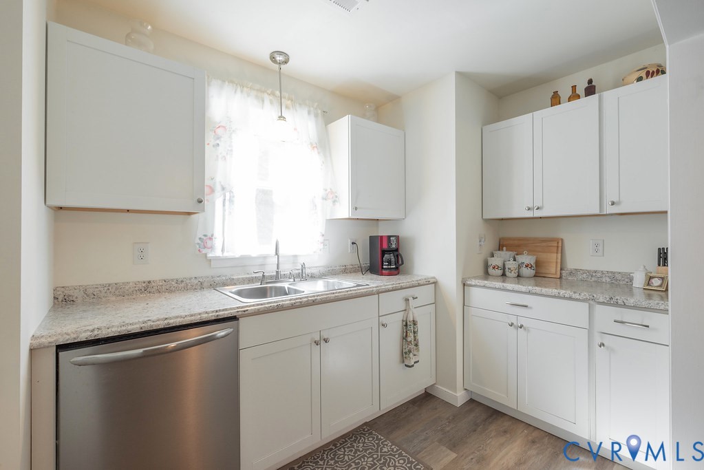 19001 Old Stage Road Dinwiddie, VA 23841 - Photo 28 of 84 a kitchen with a sink dishwasher window and cabinets