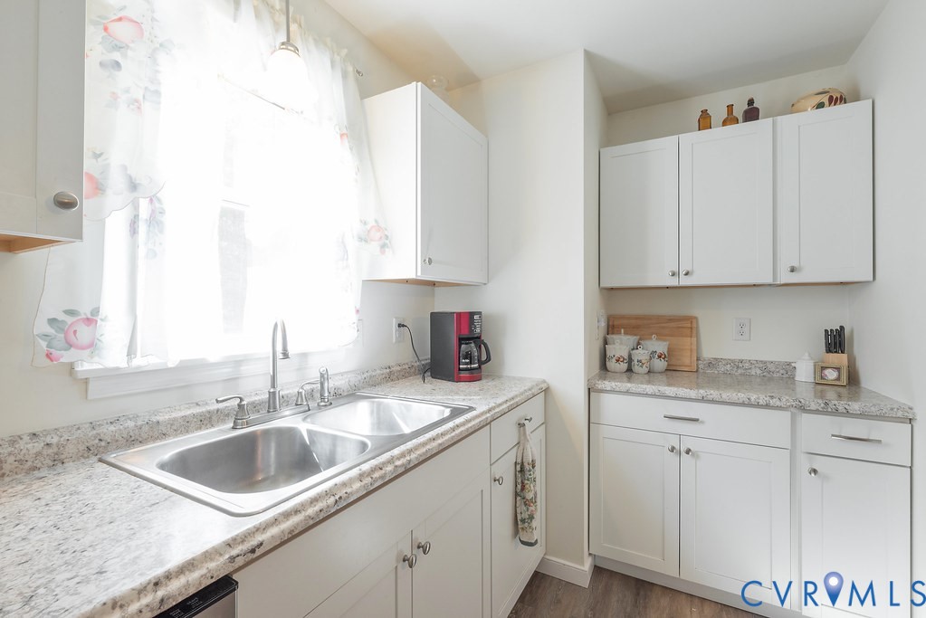 19001 Old Stage Road Dinwiddie, VA 23841 - Photo 30 of 84 a kitchen with granite countertop a sink a stove and cabinets