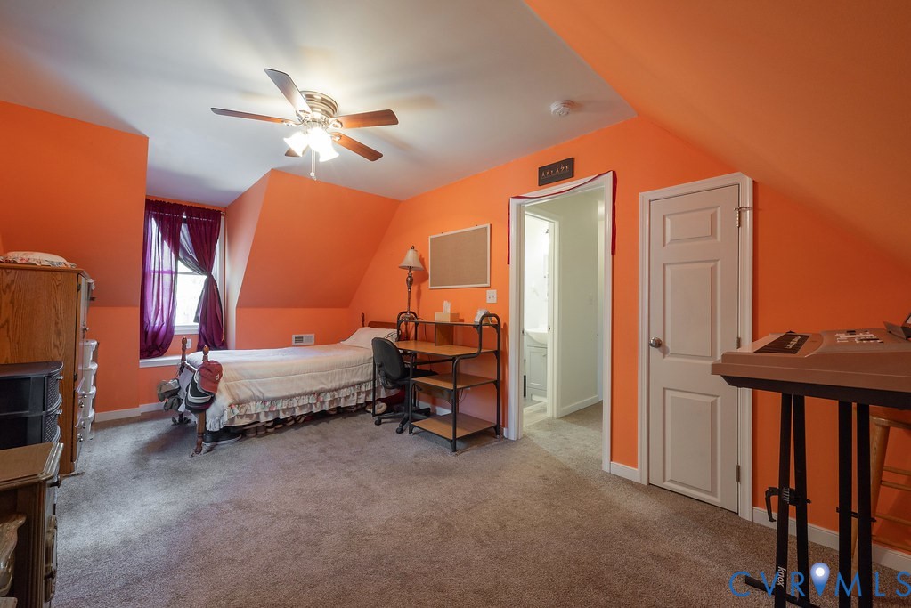 19001 Old Stage Road Dinwiddie, VA 23841 - Photo 39 of 84 a bedroom with a bed and a chandelier