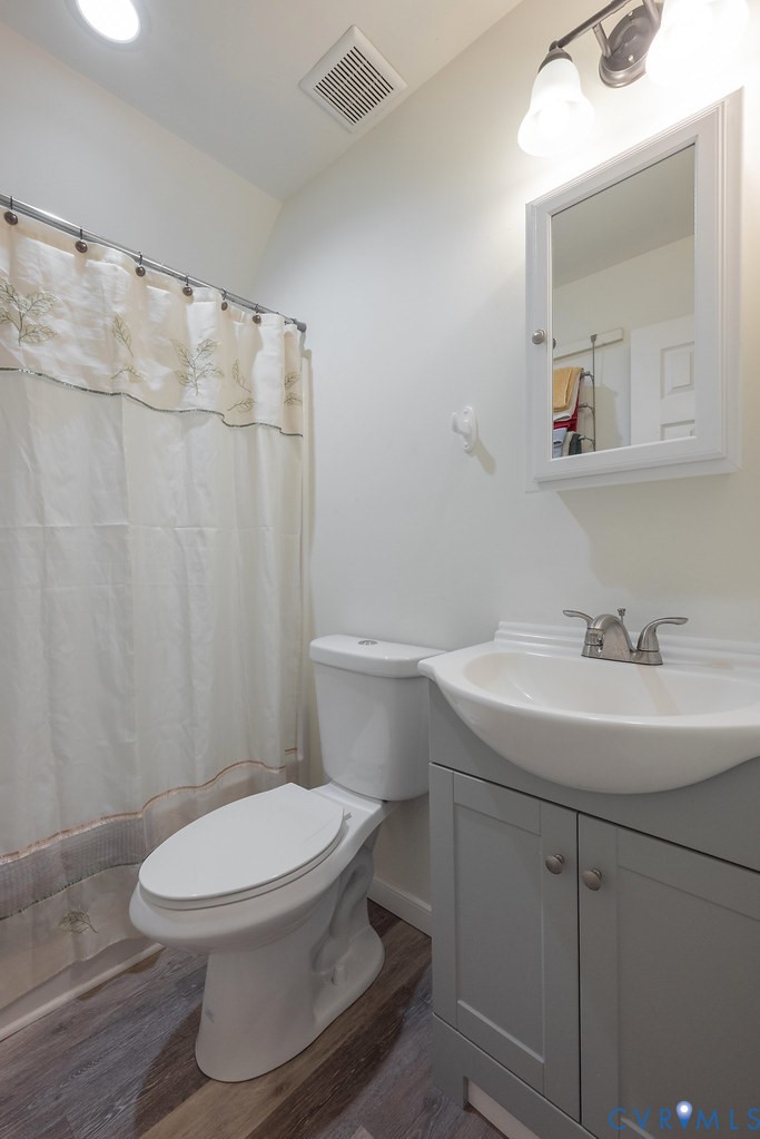 19001 Old Stage Road Dinwiddie, VA 23841 - Photo 41 of 84 a white toilet sitting next to a bathroom sink