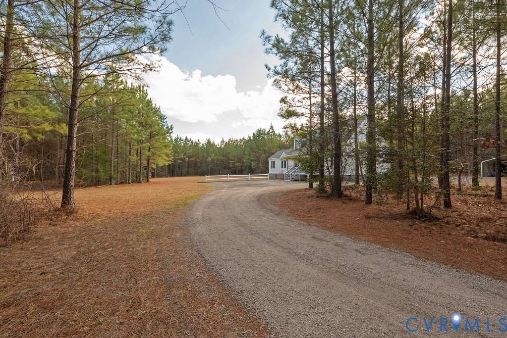 19001 Old Stage Road Dinwiddie, VA 23841 - Photo 48 of 84 a view of dirt field with trees in the background