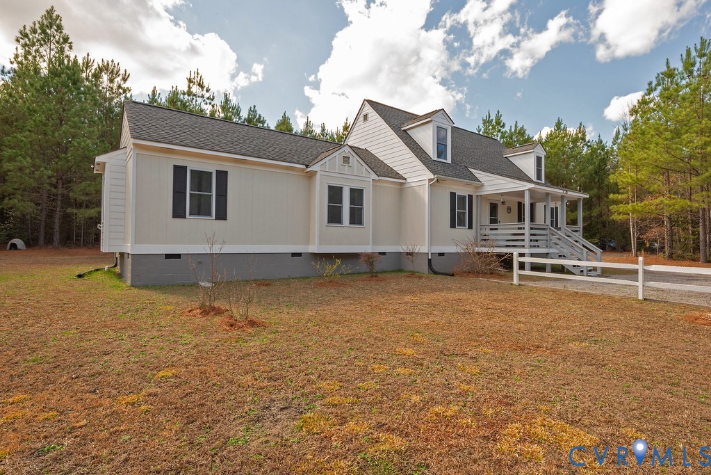 19001 Old Stage Road Dinwiddie, VA 23841 - Photo 51 of 84 a front view of a house with garden